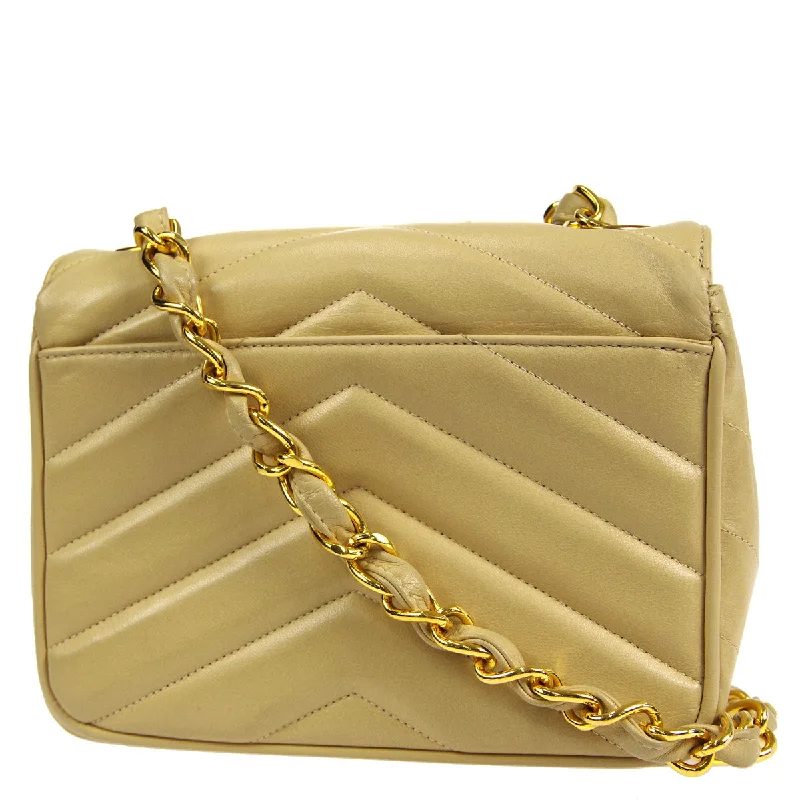 Chanel * 1994-1996 Beige Lambskin Mini Chevron Letter Flap Bag